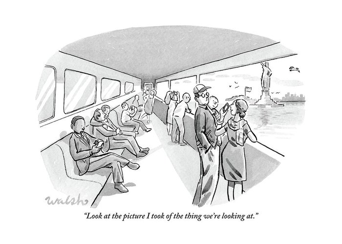 wife-shows-husband-a-photo-on-her-cell-phone-liam-walsh